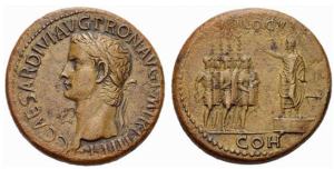 roman coin, Sestertius of Caligula - obverse: shows the wreathed head of Caligula with the caption “C CAESAR DIVI AVG PRON AVG P M TR P III P P”. Reverse: Caligula standing on a platform addressing five helmeted soldiers with shields, parazonia and two aquila. It bears a legend “ADLOCVT COH”