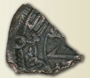 The Umayyad dirham from Woodstown, Co.Waterford, which measures 9 mm by 7 mm by 1 mm