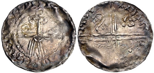 Hiberno-Norse. temp. Murchad mac Diarmata. 1052-1070. AR Penny (18mm, 0.50 g, 9h). Phase IV coinage, Facing bust/Long Cross type. Uncertain mint signature and moneyer. Struck circa 1055/60-1065/70. IIIIIIIIIII•III[...] II•I[...]IIII, schematized facing bearded head: pellet-in-annulet eyes, annulet cheeks, curvilinear mouth and mustache with one pellet at end, and linear beard; annulet above / IIIIII III, voided long cross, with triple crescent ends; in first and fourth angles, retrograde S with triple pellets at each end, “hand” symbol in second, and annulet-with-tail symbol in third. Blackburn 4, –; O’S 46 var. (symbol in third quarter); SCBI 8 (BM), –; cf. SCBI 32 (Belfast), 309; SCBI 22 (Copenhagen), 235; D&F 27; SCBC 6176. VF, toned, area of weak strike. Very rare.