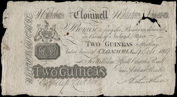 Clonmell Bank, Two Guineas (Two Pounds, Five Shillings and Sixpence), 4 October 1809, B 168, payable in Bank of Ireland Paper, for William Riall, Charles Riall and Arthur Riall, signature of Arthur Riall. Endorsements on back, pinholes, small holes, tear and missing small piece at top right, otherwise very good. The Old Currency Exchange, Dublin, Ireland.