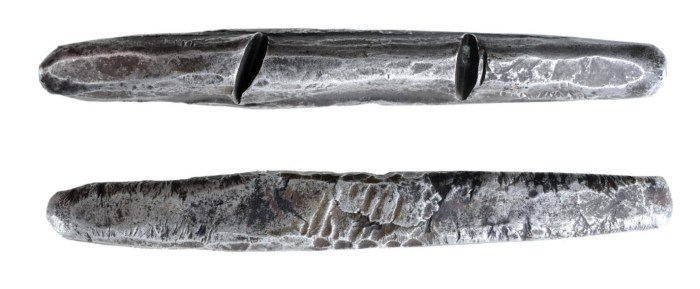 A 'cast' Viking Silver Trade Ingot, c. 800-1000 AD – a sub-rectangular in plan and ovate in section, and tapering to a rounded point at each end. The Old Currency Exchange, Dublin, Ireland.