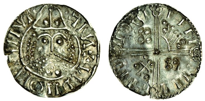 Hiberno-Norse, phase IV, 'scratched-die' coins, c.1060-65, Penny, 0.77g, bearded, helmeted bust facing, retrograde blundered legend, rev. blundered legned, voided long cross, symbols in angles (cf SCBI 8, 155-156; D.F. 27; S.6136), small chip, edge cracks, crease, a good example of this issue, very fine, rare